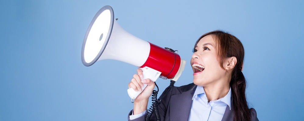 Businesswoman making announcement with megaphone-177887-edited.jpeg