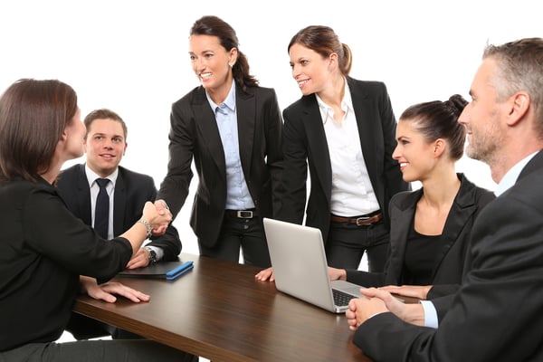 Men and women meeting in an office