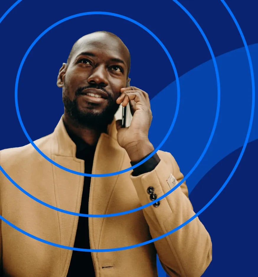 man-talking-phone-blue-background-rings