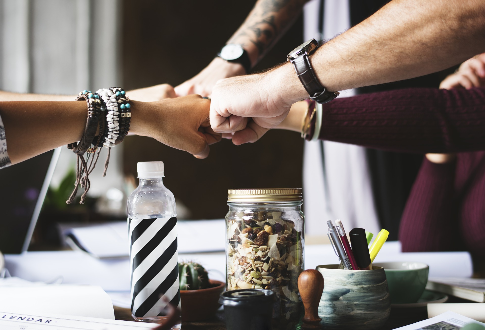 Fist bumps in an office setting