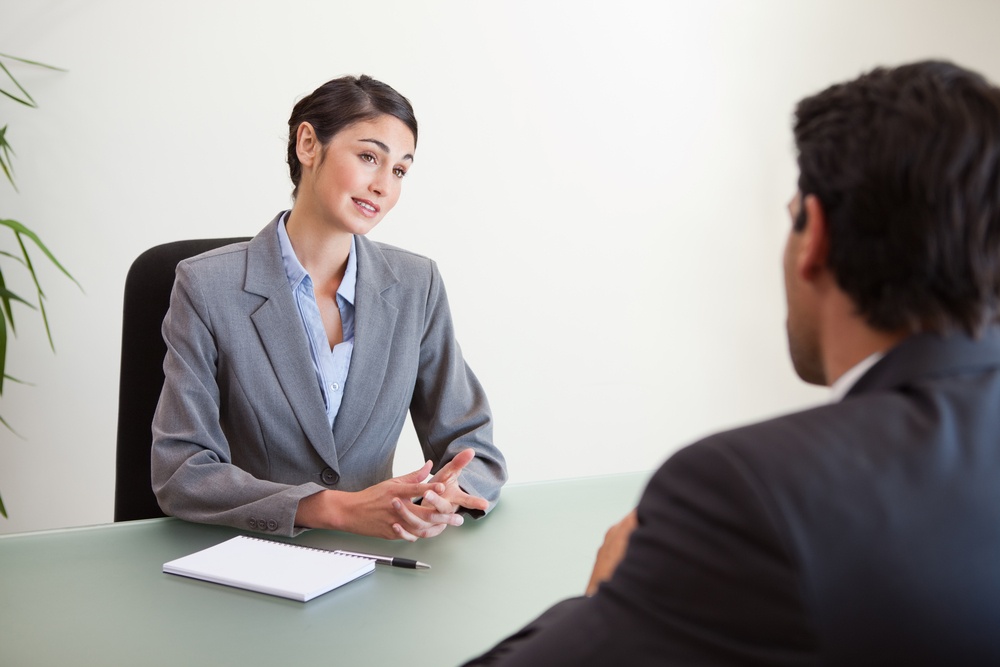 Manager interviewing a good looking applicant in her office.jpeg