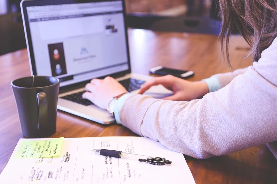 business woman who is researching and taking notes